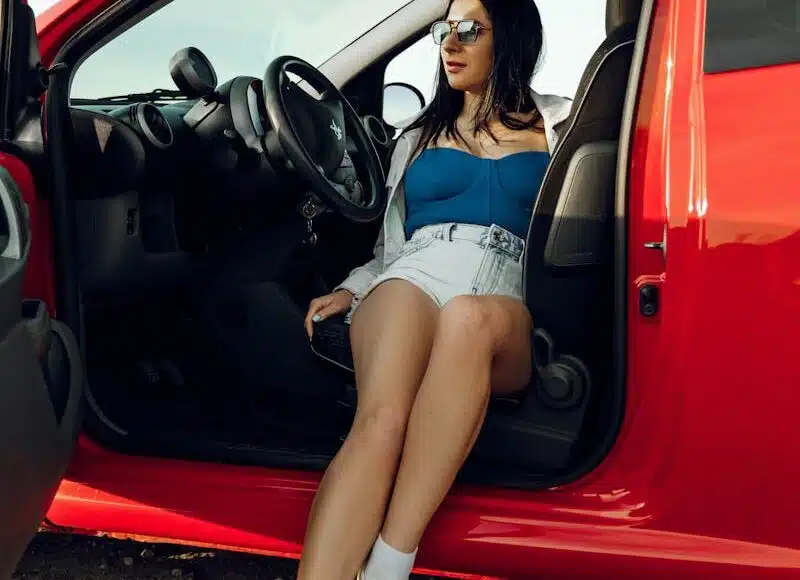 Woman Sitting and Posing in Car